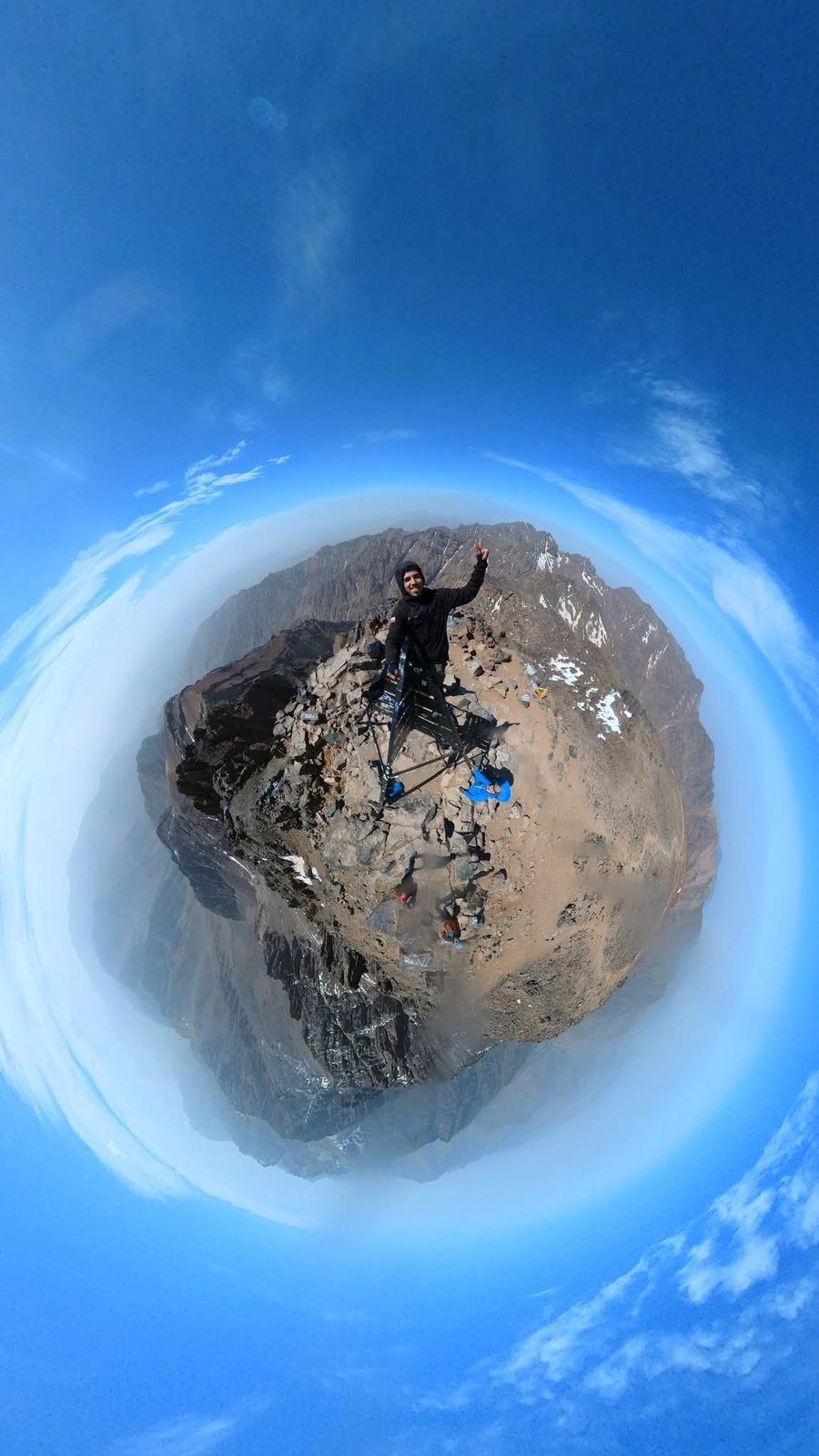 Trekker on the Mount Toubkal summit at sunrise, High Atlas Mountains, Morocco